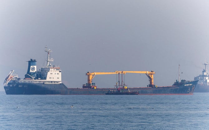 Joint Coordination Centre officials board a cargo ship as it waits to pass the Bosphorus strait off the shores of Yenikapi in Istanbul, Turkiye, October 31, 2022. (Reuters)