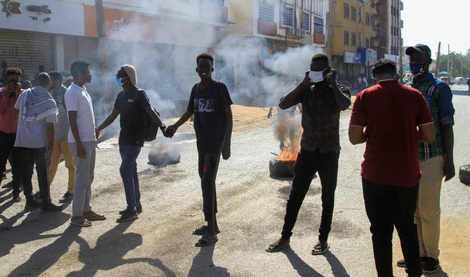 Sudanese anti-coup demonstrators block a road with burning tyres amid clashes with security forces during a protest in the Sharwani Bus Station area of the capital Khartoum, on November 8, 2022. (AFP)