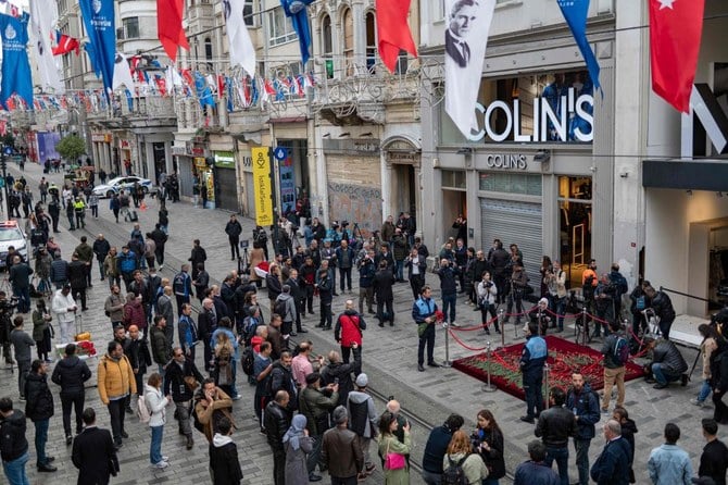 People mourn the victims of November 13 explosion at the busy shopping street of Istiklal in Istanbul on November 14, 2022. (AFP)