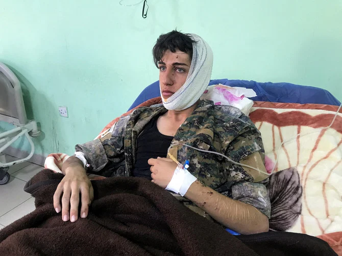 A wounded man lies in a hospital bed after rockets hit the headquarters of an Iranian Kurdish party in the city of Koye, near the capital of Iraq's autonomous Kurdish region Erbil, Iraq November 14, 2022. (Reuters)
