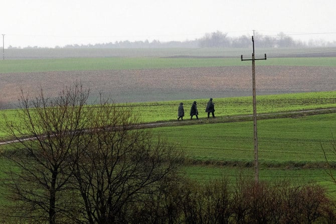 Police officers walk near the site of an explosion in Przewodow, a village in eastern Poland near the border with Ukraine, November 16, 2022. (Reuters)