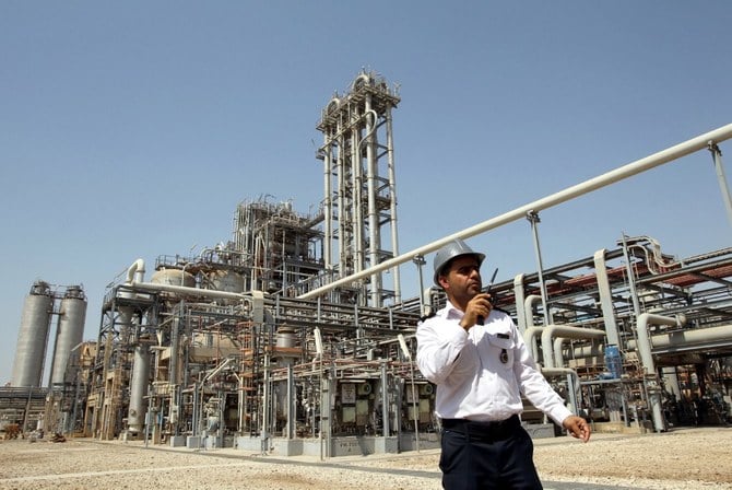 An Iranian security guard talks on his walkie-talkie outside the Mahshahr Petrochemical Complex in the southwestern province of Khuzestan. (File/AFP)