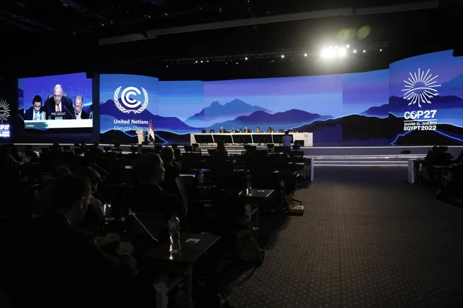 Sameh Shoukry, president of the COP27 climate summit, center, speaks during the closing plenary session at the COP27 UN Climate Summit in Sharm El-Sheikh, Egypt. (AP)