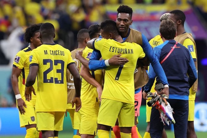 Ecuador players celebrate after they won the Qatar 2022 World Cup Group A football match against Qatar at the Al-Bayt Stadium in Al Khor, north of Doha on November 20, 2022. (AFP)