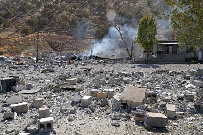 Above, damage from an earlier Iranian cross-border missile attack in Zargwez, around 15 kilometers from the Iraqi city of Sulaimaniyah on Sept. 28, 2022. (AFP file photo)