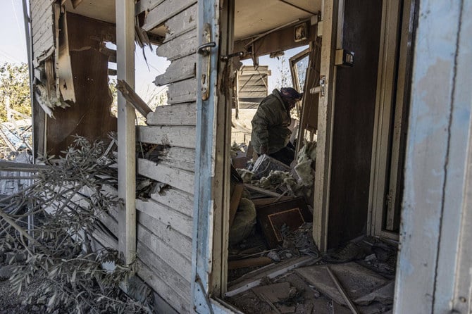 A man inspects a site damaged by Turkish airstrikes that hit an electricity station in the village of Taql Baql, in Hasakah province in Syria on Nov. 20, 2022. (AP)