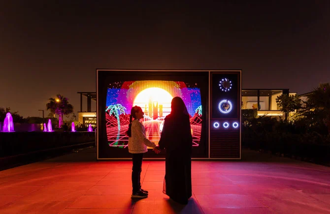 Saudi artist Mohammed Al-Sanie’s work ‘Dreams in Color,’ is an outdoor LED installation presenting an alternative version of Riyadh via video loops displayed on a screen framed by wood. (Supplied/Noor Riyadh)