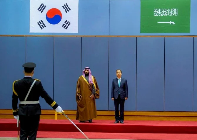 South Korea’s Prime Minister Han Duck-soo welcoming Saudi Crown Prince Mohammed bin Salman in Seoul. (Saudi Royal Palace)