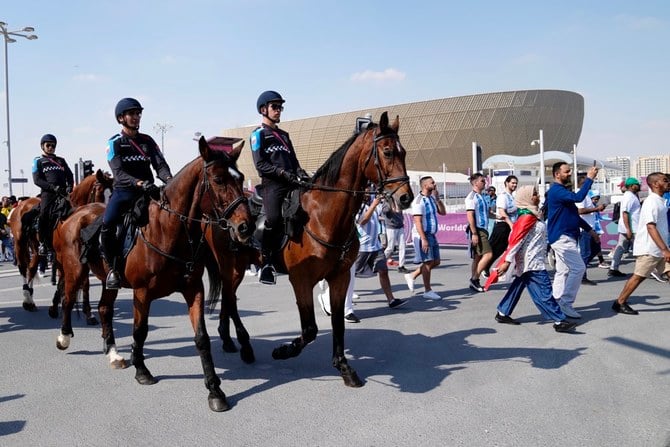 Qatari police patrol on horseback outside of the Lusail Stadium. (AP)