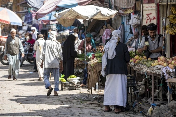 People shop for fresh produce in an open-air market in Yemen's third city of Taiz on October 4, 2022. (AFP)