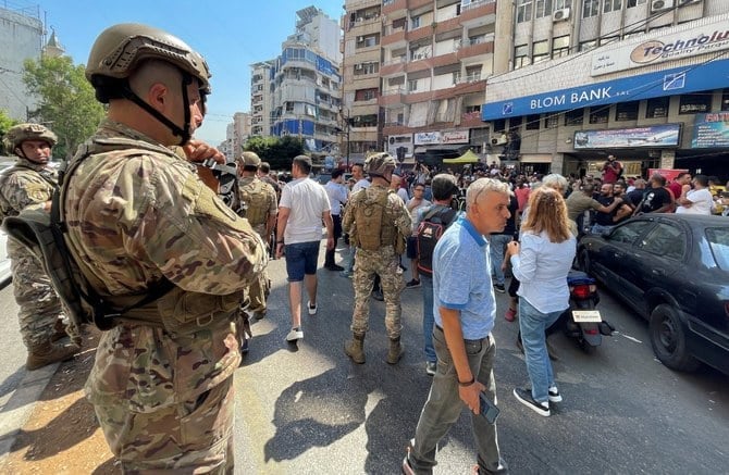 Two attempted bank holdups and a sit-in protest on Wednesday highlighted the growing desperation of Lebanese people grappling with the country’s worsening economic crisis. (Reuters/File)