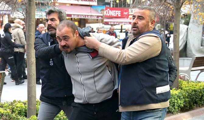 Police in Ankara arrest members of the Peoples’ Democratic Party during a protest against the Turkish strikes in the northern regions of Iraq and Syria. (AFP)