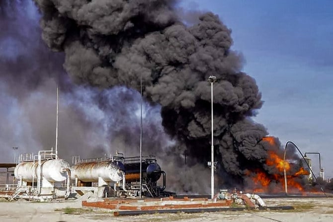 A fire rages at a hydrocarbon facility reportedly following a Turkish air strike in the vicinity of Tal Awdah in northeastern Syria's Hasakah province. (AFP)