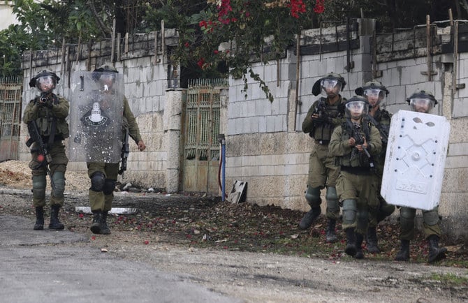 Israeli forces during clashes with Palestinian demonstrators following a protest against the expropriation of Palestinian land by Israel in the West Bank. (File/AFP)