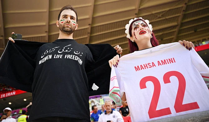 Demonstrators stage a protest at the soccer match between Wales and Iran. (AP)