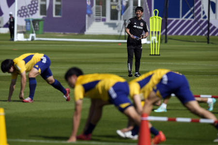 Japan's head coach Hajime Moriyasu watches his team during a training session of Japan national team in Doha, Qatar, Friday, Nov. 25, 2022. (AP)