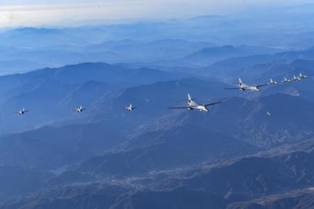In this photo provided by South Korean Defense Ministry, two US Air Force B-1B bombers (center), four South Korean Air Force F-35 fighter jets and four US Air Force F-16 fighter jets fly over South Korea Peninsula during a joint air drill called 