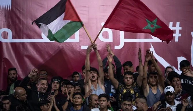 Palestinians watch the World Cup quarterfinal between Morocco and Portugal in Gaza City, Saturday, Dec. 10, 2022. (AP Photo)