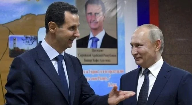 Bashar Assad and Vladimir Putin, Damascus, Syria, Jan. 7, 2020. (AP/File)