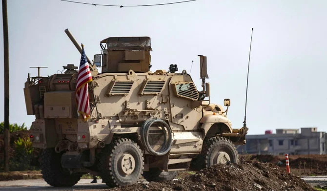 US forces patrol near the countryside of Rumaylan (Rmeilan) in Syria's northeastern Hasakeh province near the Turkish border, on December 2, 2022. (AFP)