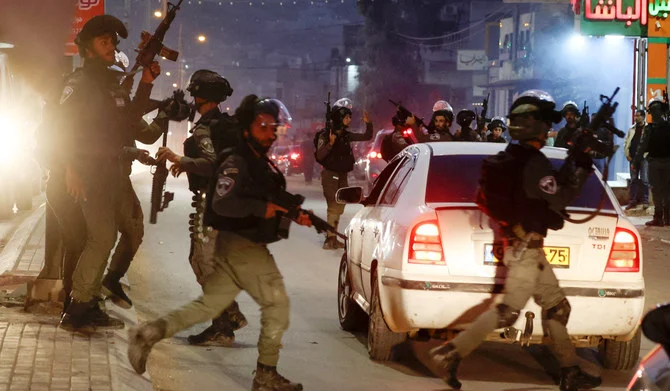 Israeli security forces deploy in the occupied West Bank city of Hawara, following an incident during which a Palestinian man was reportedly shot dead by Israeli police, on December 2, 2022. (AFP)