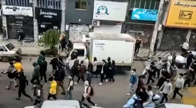 Iranian protesters march through the streets of the city of Some-Sara, in the northern Gilan province. (AFP/File)