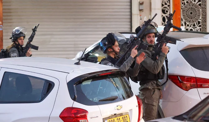 Israeli security forces are pictured during a military operation in the occupied West Bank city of Hawara, on December 2, 2022. (AFP)