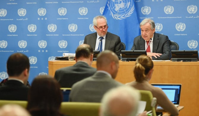 United Nations Secretary General Antonio Guterres with Stephane Dujarric (L), Spokesman for the Secretary General speaks during a press briefing at United Nations Headquarters on February 4, 2020 in New York City. (AFP)