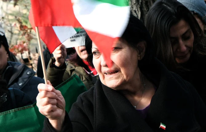 A woman joins protestors as they gather outside of an Iranian diplomat's residence to denounce the Iranian government and the recent execution of a protester on December 10, 2022 in New York City. (AFP)