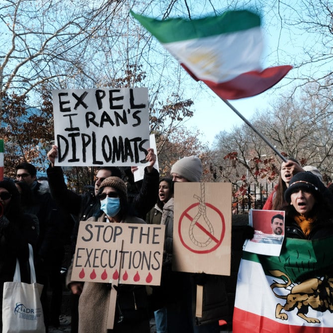 People gather outside of an Iranian diplomat’s residence in New York City to denounce the Tehran regime and the recent execution of a protester. (AFP)
