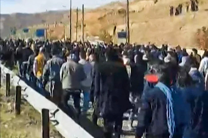 Iranian protesters march and chant slogans in Piranshahr, in western Iran. (AFP)
