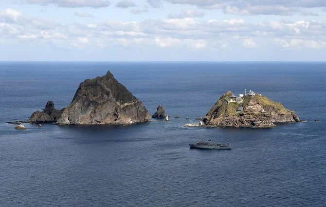 Above, the disputed islands known as Dokdo in South aKorea and Takeshima in Japan. (Korea Coast Guard/AFP file photo)