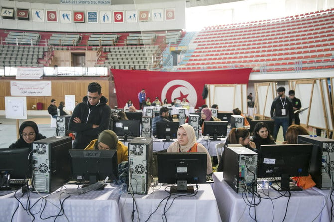 Members of the Independent Higher Authority for Elections count the votes one day after the parliamentary elections in Tunis. (AP)