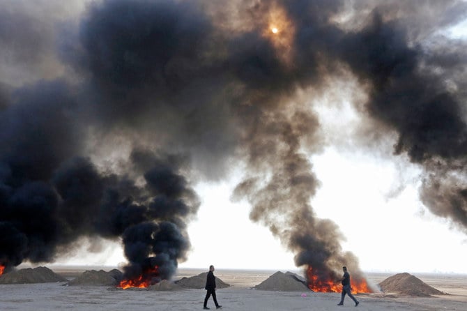 raqi government officials destroy nearly six tons of drugs, some of which had been in storage for more than a decade, in Baghdad's Nahrawan area on December 18, 2022. (AFP)