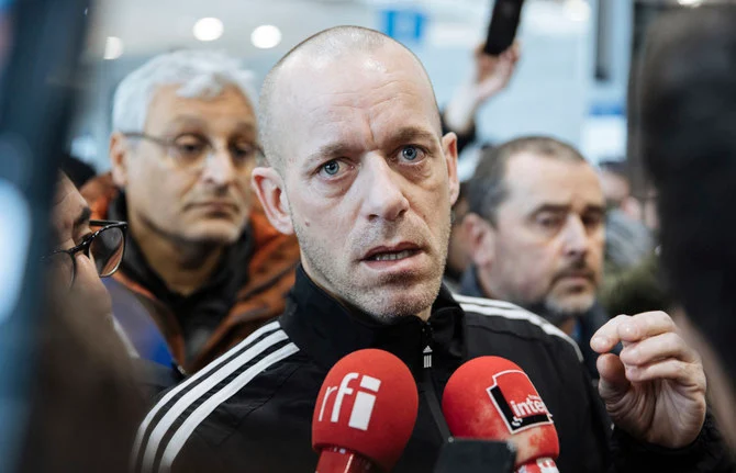 Palestinian French lawyer and activist Salah Hammouri talks with the press as he arrives at the Charles de Gaulle Airport after his extradition from Israel to France, Sunday, Dec. 18, 2022, in Paris. (AP)