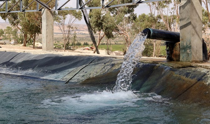 Water is pumped from a well into a pond to irrigate Hamemi agricultural farm in Kasserine, Tunisia, October 6, 2022. (Reuters/File)