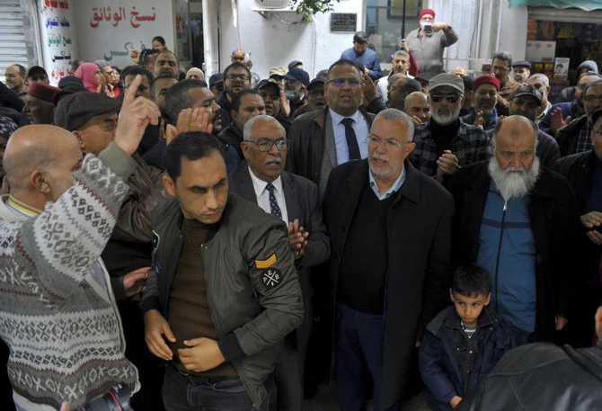 Supporters of the Tunisian Islamist movement Ennahda stage a protest in front of the justice ministry to denounce the arrest one of its senior leader in Tunis on Dec. 23, 2022. (AP)
