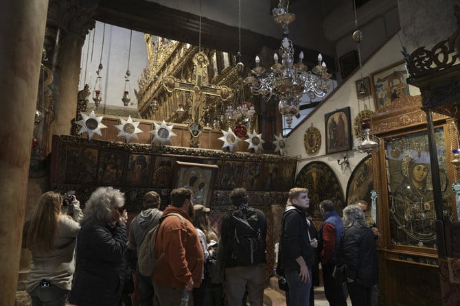 Tourists and worshipers visit the Church of the Nativity, traditionally believed to be the birthplace of Jesus Christ, in Bethlehem.(AP)