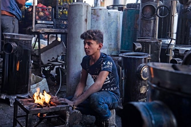 A young Syrian worker sells heaters as winter approaches in Raqqa, scene of some of the worst fighting of the conflict. (AFP)