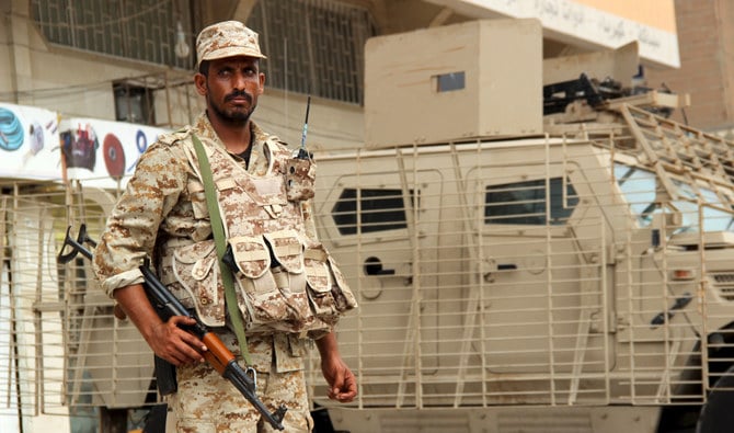 A Yemeni soldier stands guard on a street in Aden. The Omani mediators, who arrived in Sanaa last week, departed the city on Sunday. (Reuters/File)