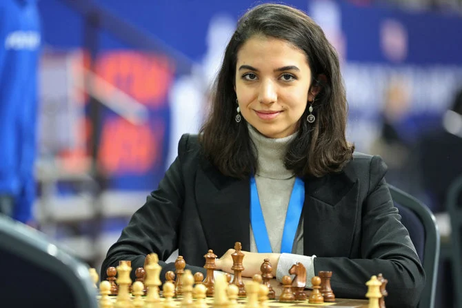 Sara Khadem of Iran sits in front of a chess board. (Reuters)