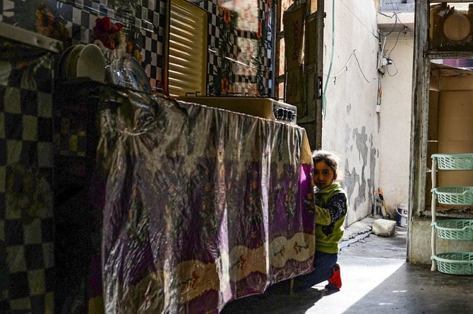 One of the children of Alia Abdel-Razak, a woman deprived of crucial civil status documents. Abdel-Razak, like many in Mosul struggles with endless red tape, but also the fallout from the gruelling battle to defeat of Daesh to obtain documents like marriage and birth certificates. (AFP)