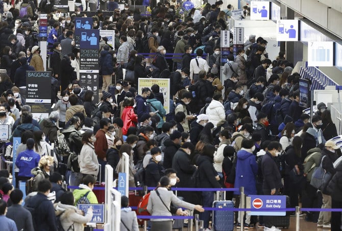 Direct flights between China and Japan will be limited to four major Japanese airports for now. Above, Haneda airport in Tokyo on Dec. 29, 2022. (Kyodo News via AP)