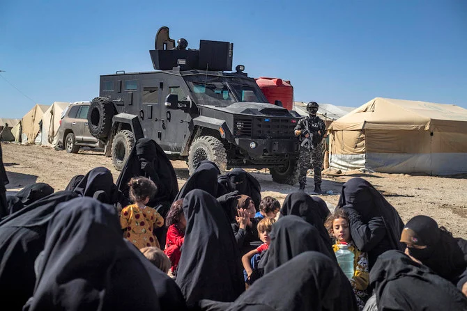 A member of the Syrian Kurdish Asayish security forces stands guard during an inspection of tents at the Kurdish-run al-Hol camp, which holds relatives of suspected Daesh group fighters in the northeastern Hasakeh governorate as the Syrian Democratic Forces mount a security campaign against Daesh