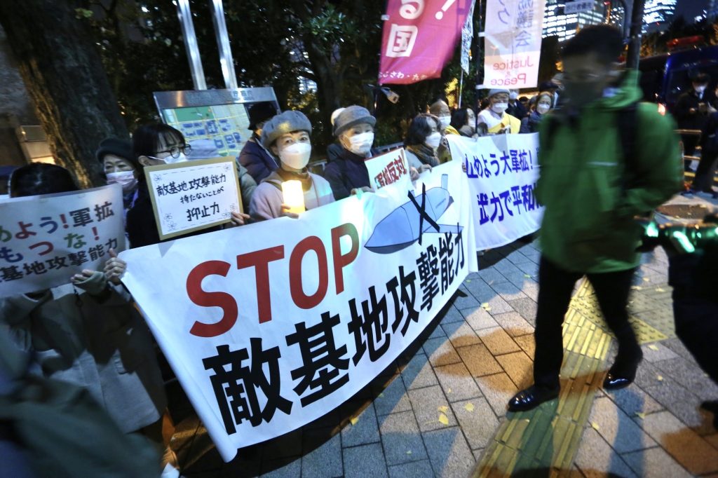 The demonstrators held up signs and chanted slogans calling for an end to military expansion and the development program for new long-range missiles. (ANJ/ Pierre Boutier)