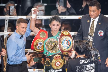 Japan’s Naoya celebrates his victory over Britain’s Paul Butler during their bantamweight title unification boxing bout in Tokyo on December 13, 2022. (AFP)