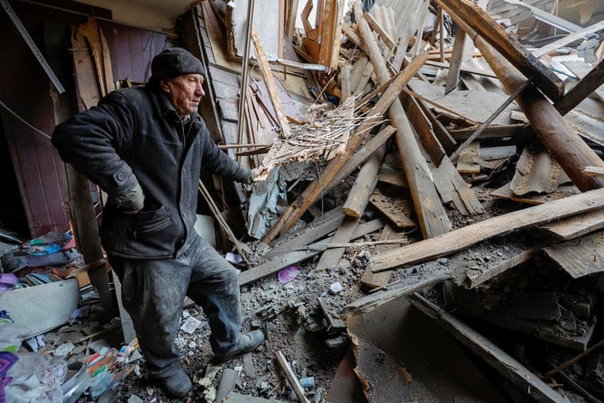 Local resident Sergei stands amid debris of his apartment in a building heavily damaged in recent shelling in the course of Russia-Ukraine conflict in Horlivka (Gorlovka) in the Donetsk region, Russian-controlled Ukraine, December 13, 2022. (Reuters)