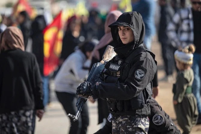 A Syrian Kurdish Asayish guard at a demo condemning Turkish strikes on Kurdish areas. (AFP/File)