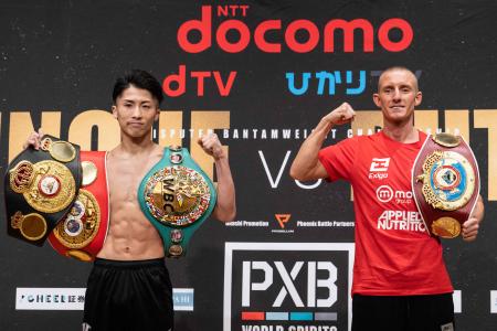 Naoya Inoue from Japan (left) and England's Paul Butler pose for photographs following a weigh-in ahead of their December 13 bantamweight fight, in Yokohama on December 12, 2022. (AFP)