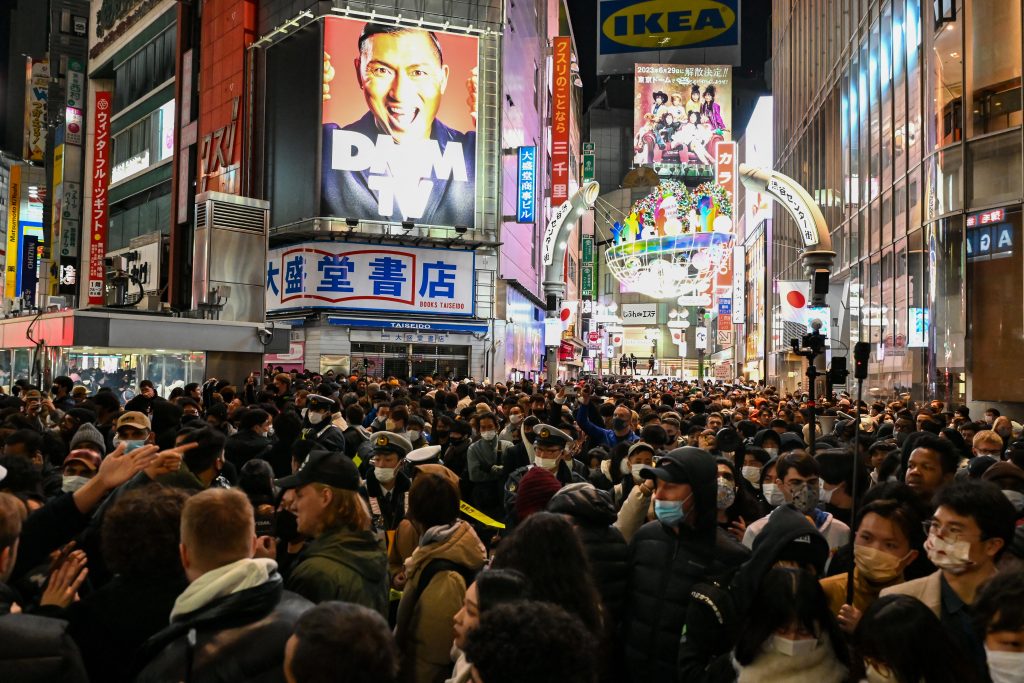 Tokyo had the largest weekly number of new cases, at 104,006. (AFP)